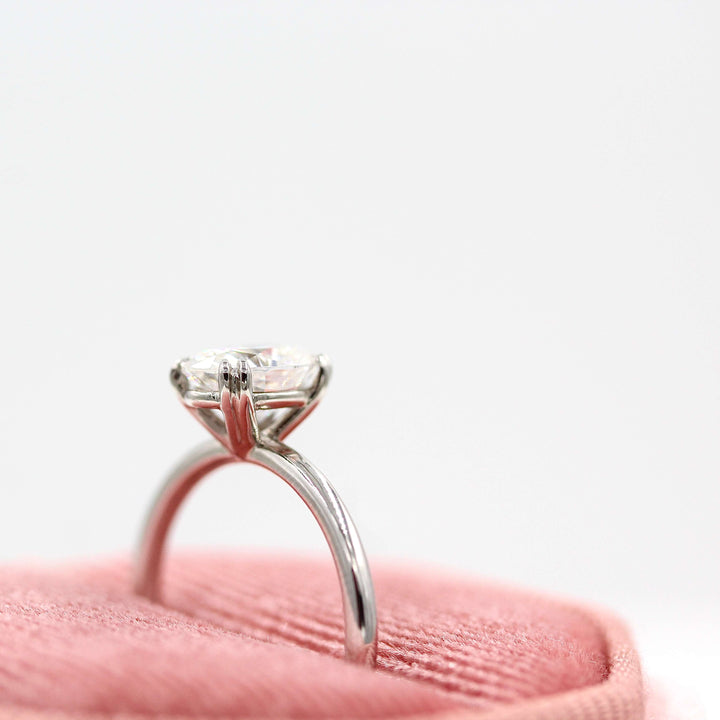The Serena ring round in white gold in a pink velvet ring box