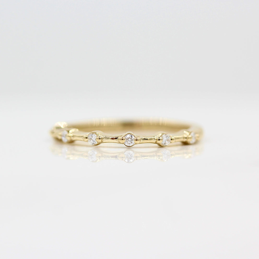 The Sloane Wedding Band in Yellow Gold against a white background