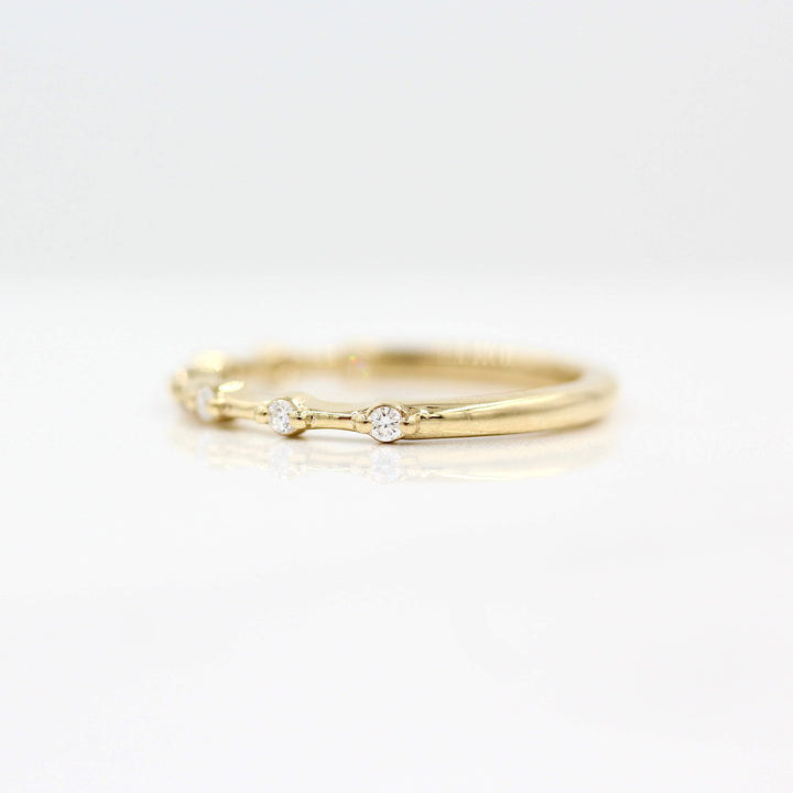 The Sloane Wedding Band in Yellow Gold against a white background