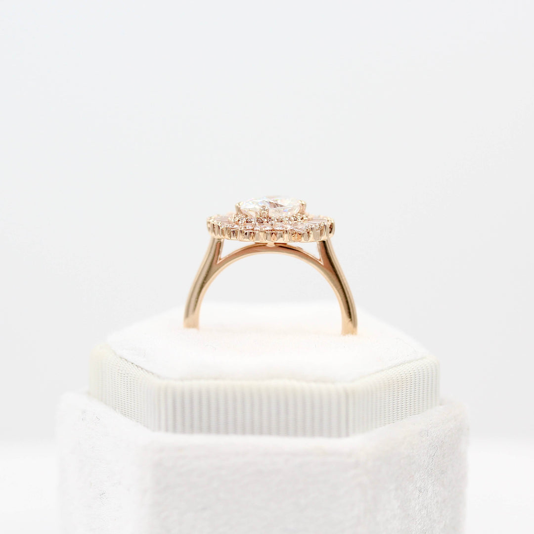 The Soleil Ring in Rose Gold and Moissanite in a white velvet ring box
