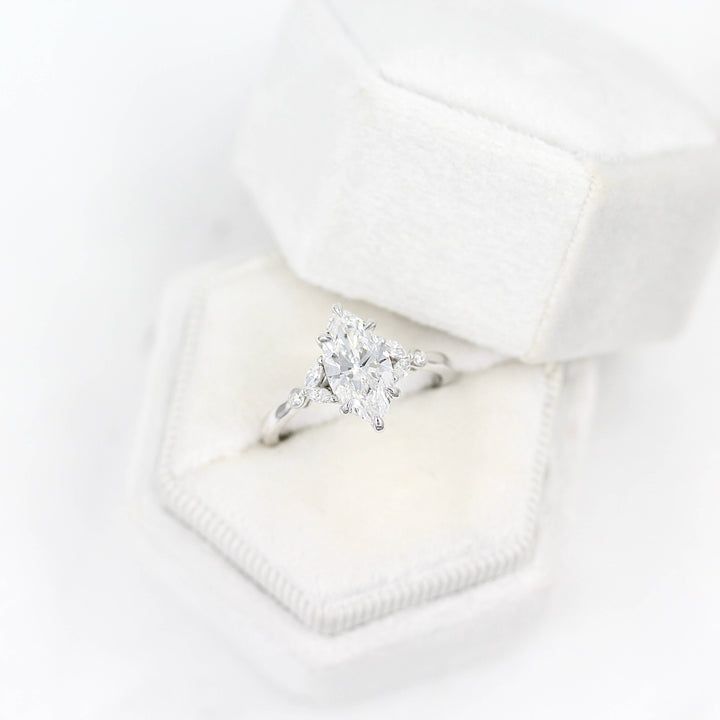 The Sophia Ring (Marquise) in white gold in a white velvet ring box