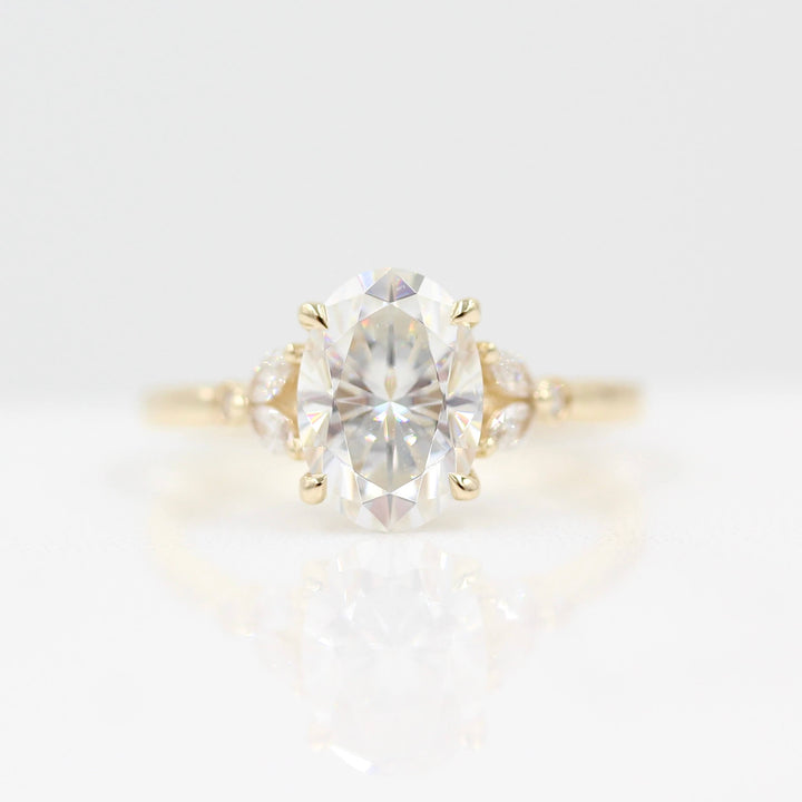 The Sophia Ring (Oval) in Yellow Gold and 2ct Moissanite against a white background