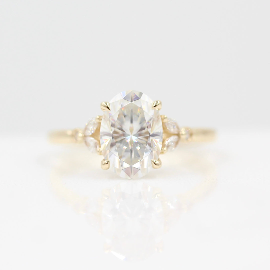 The Sophia Ring (Oval) in Yellow Gold and 2ct Moissanite against a white background