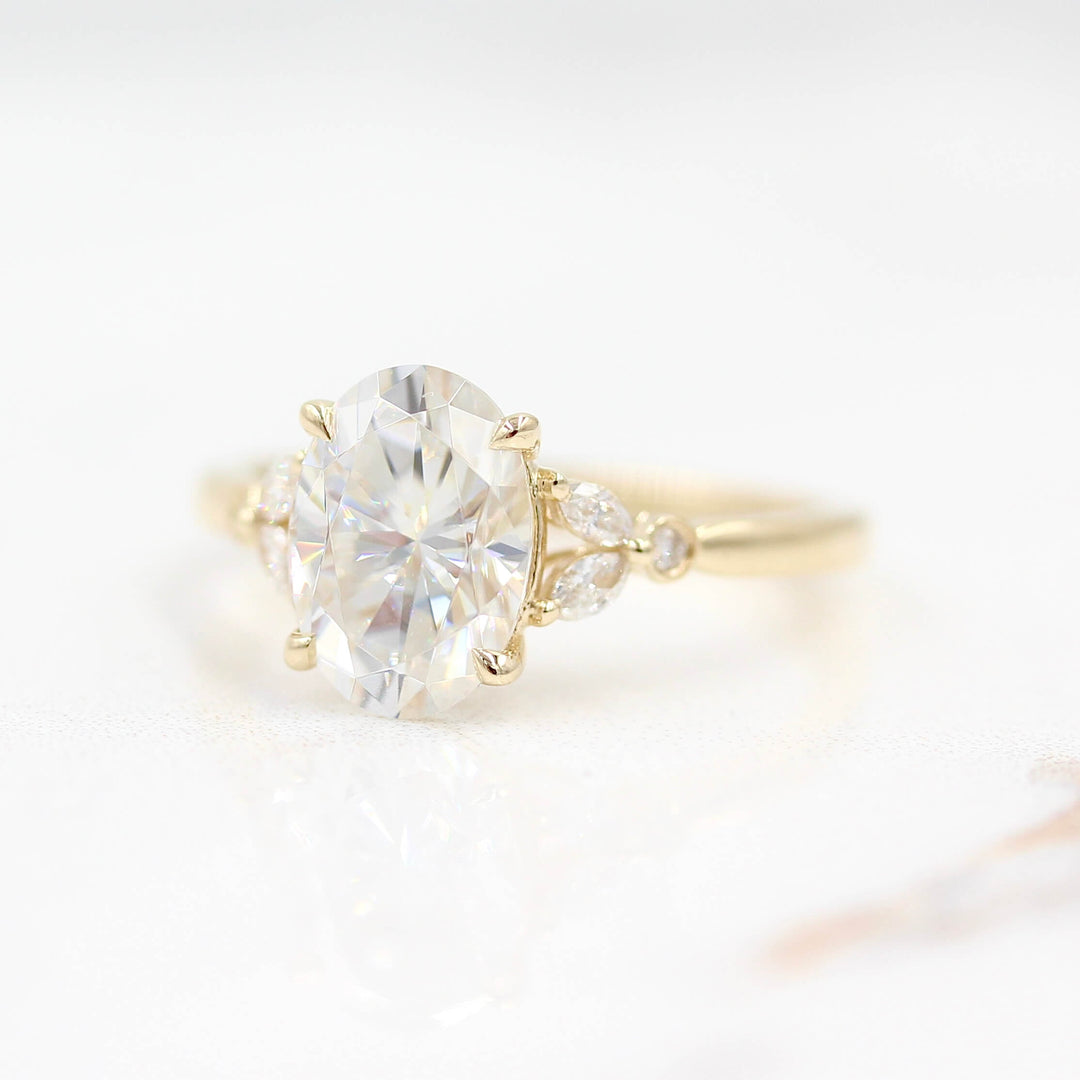 The Sophia Ring (Oval) in Yellow Gold and 2ct Moissanite against a white background