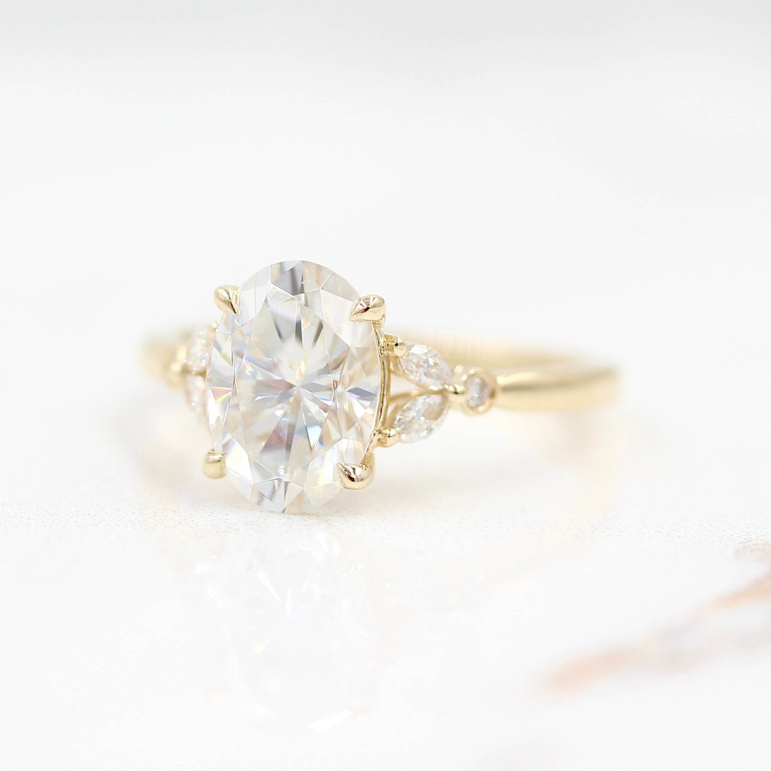 Ready to Ship Ring 14k Yellow Gold The Sophia Ring (Oval) in Yellow Gold with 2ct Moissanite against a white background