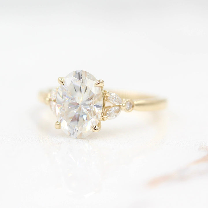 Ready to Ship Ring 14k Yellow Gold The Sophia Ring (Oval) in Yellow Gold with 2ct Moissanite against a white background