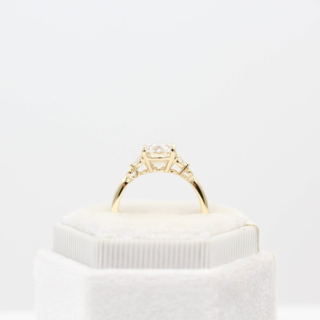 The Sophia Ring (Oval) in Yellow Gold and 2ct Moissanite in a white velvet ring box