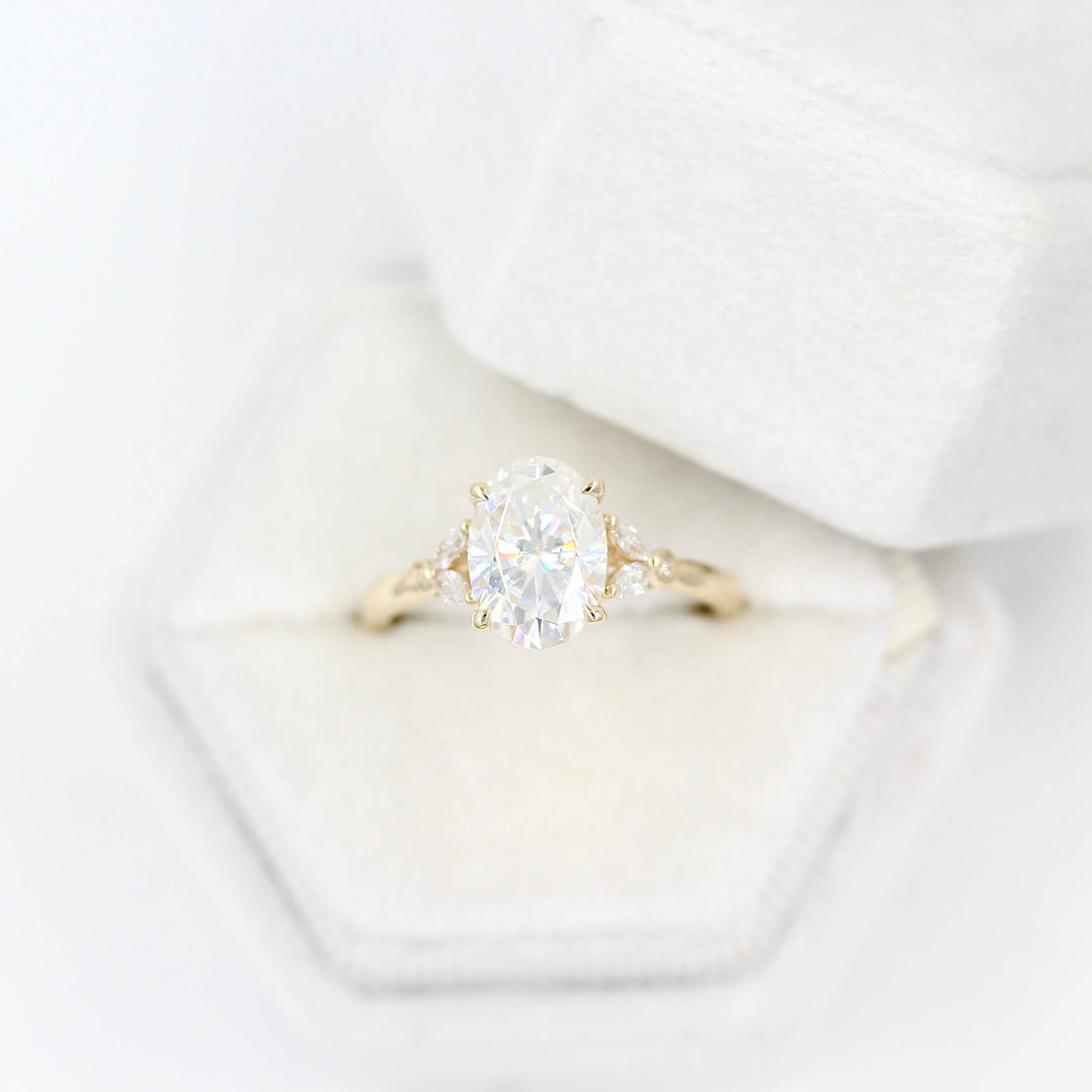 The Sophia Ring (Oval) in Yellow Gold and 2ct Moissanite in a white velvet ring box