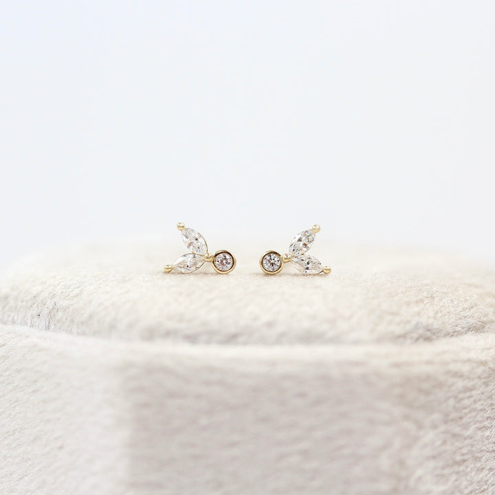 The Sophia Earrings in Yellow Gold atop a white velvet ring box