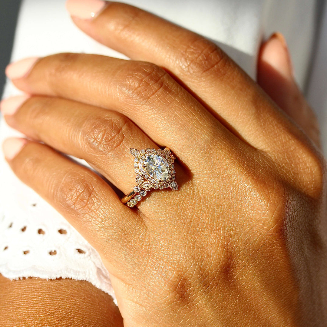 The Stella ring in yellow gold stacked with the florence wedding band in yellow gold modeled on a hand