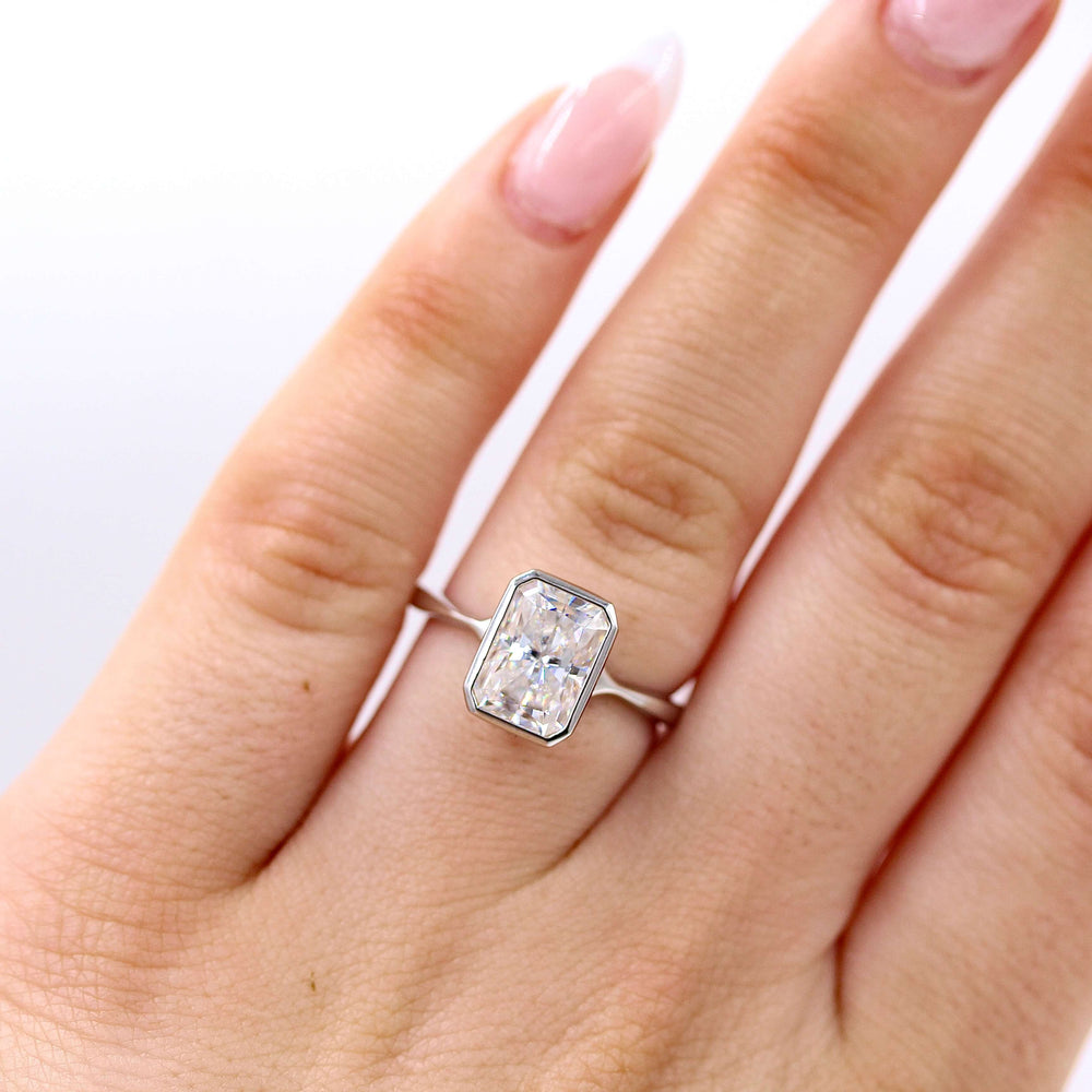 The Stevie Ring (Radiant) in White Gold with 2ct Moissanite modeled on a hand
