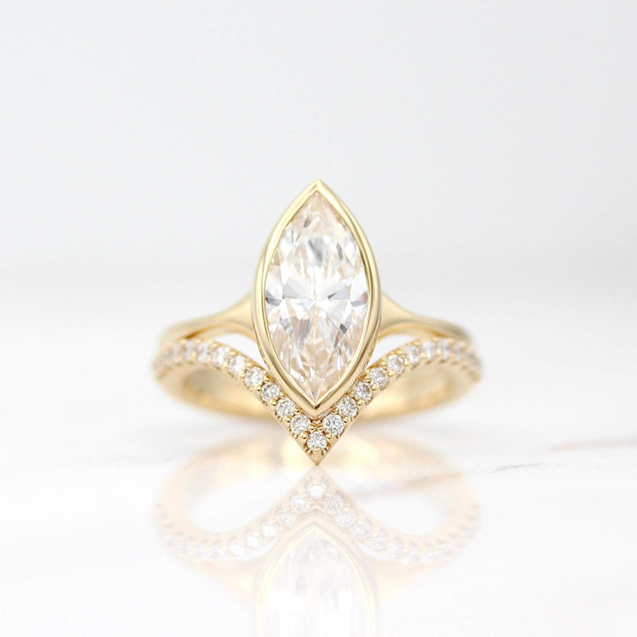 The Stevie Ring (Marquise) in Yellow Gold with a 2ct Lab-Grown Diamond stacked with the Deep Diamond V Wedding Band in Yellow Gold against a white background
