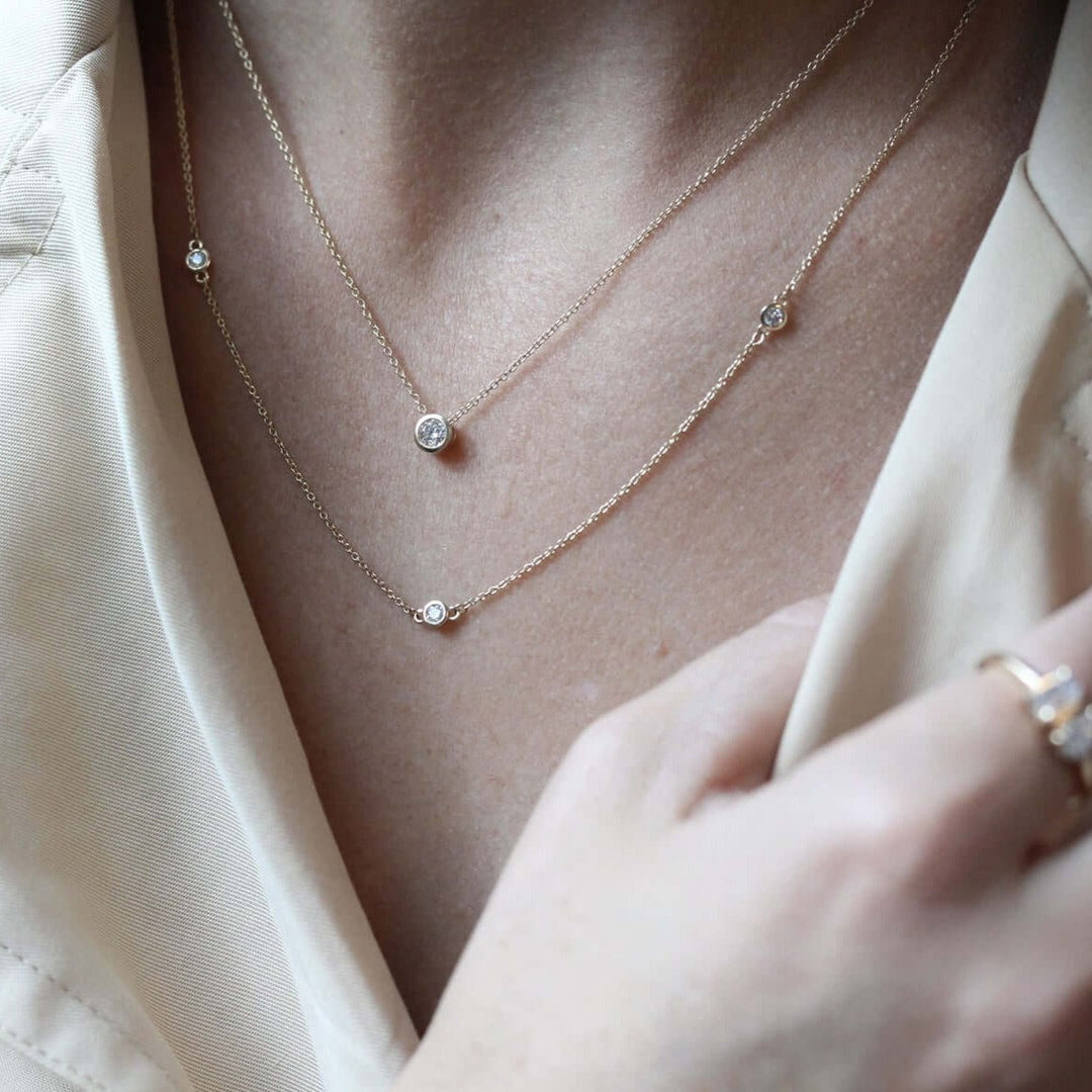 Styled shot with bezel necklace, station necklace, petite toi et moi ring and petite croissant ring