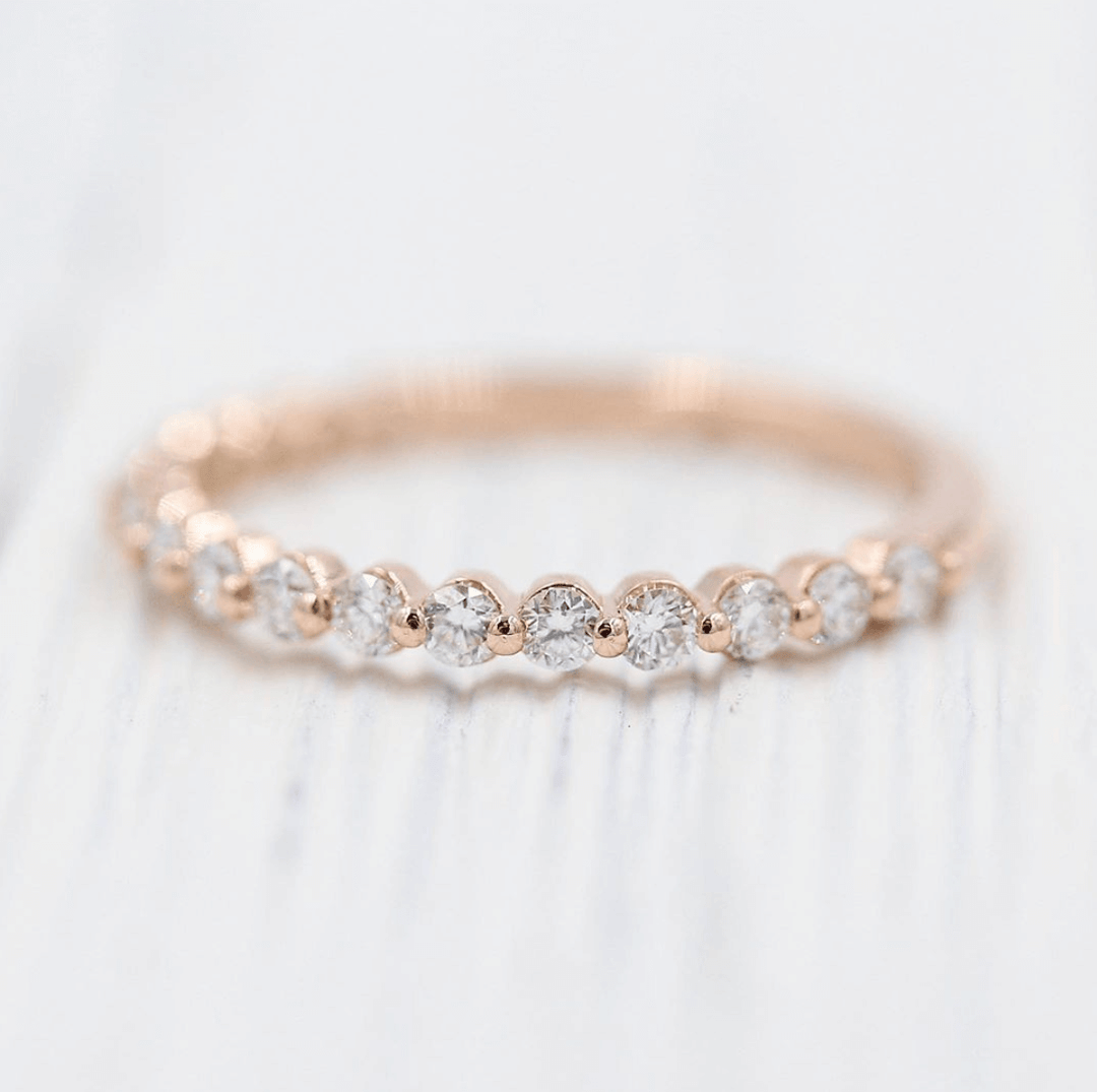 The Carly Wedding Band in rose gold against a white background