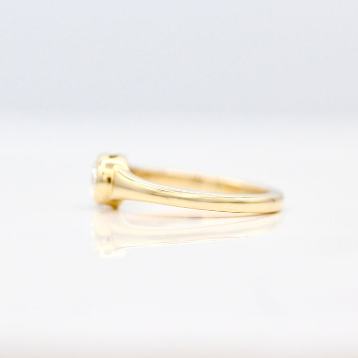 A side view of The Baby Billie Pinky Ring band in yellow gold