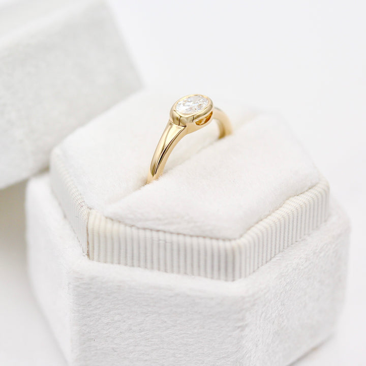 The Baby Billie in a White Ring Box with Oval Diamond