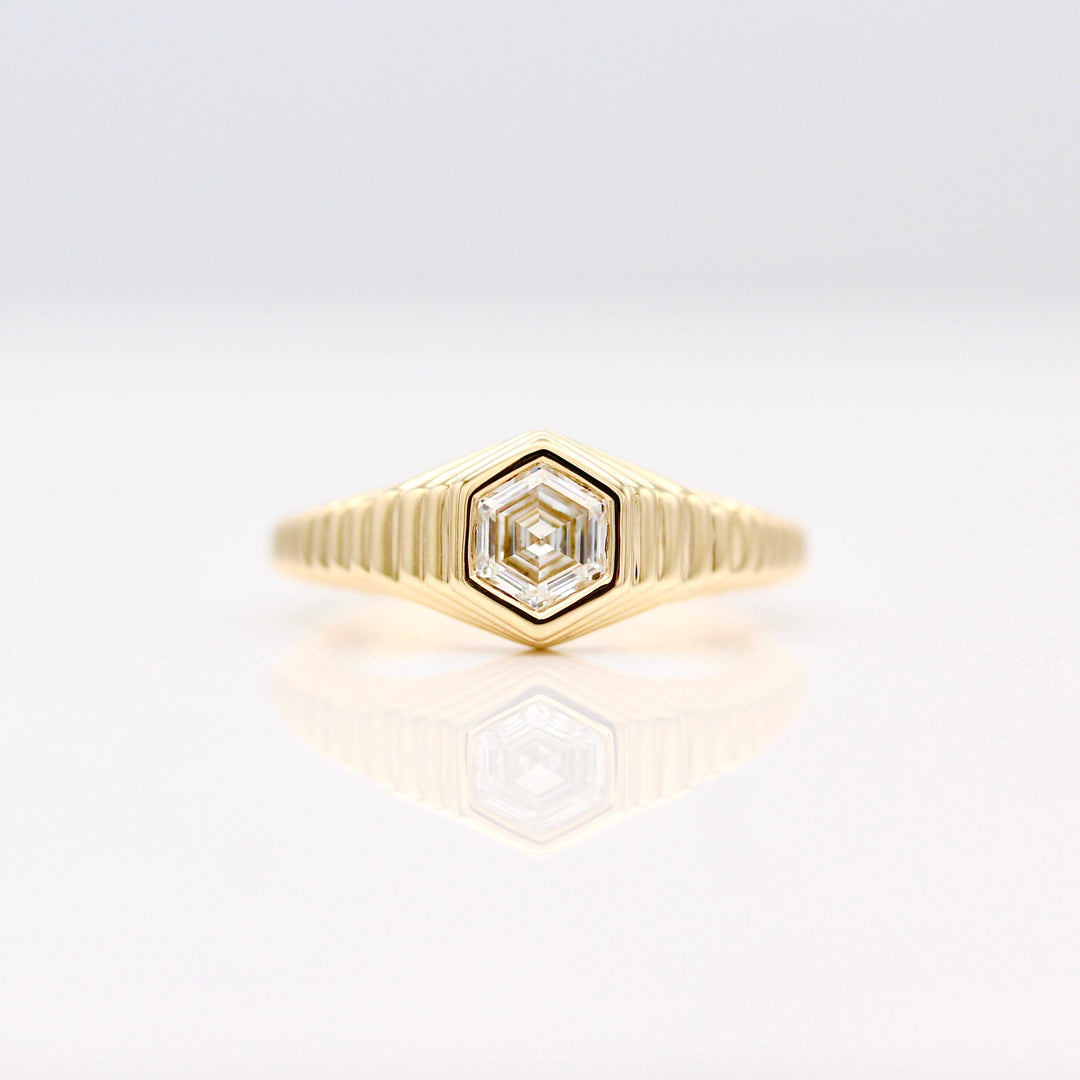The Fitz Pinky Ring in Yellow Gold with Hexagon Diamond center against a White background