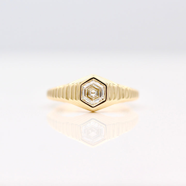 The Fitz Pinky Ring in Yellow Gold with Hexagon Diamond center against a White background