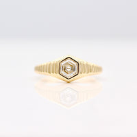 The Fitz Pinky Ring in Yellow Gold with Hexagon Diamond center against a White background