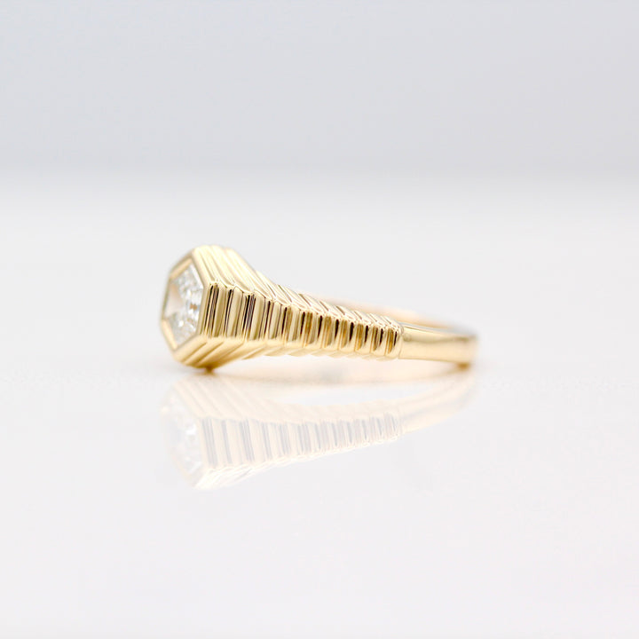 The Fitz Pinky Ring in Yellow Gold with tapered step band on a White background