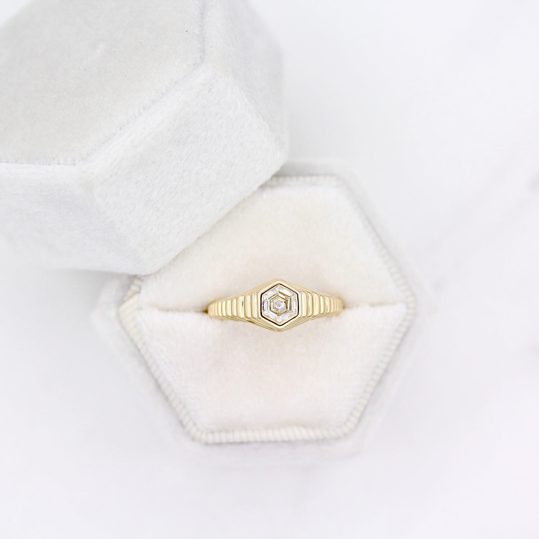Art deco inspired ring with diamond hexagon center and tapered step band in yellow gold