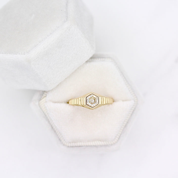 Art deco inspired ring with diamond hexagon center and tapered step band in yellow gold