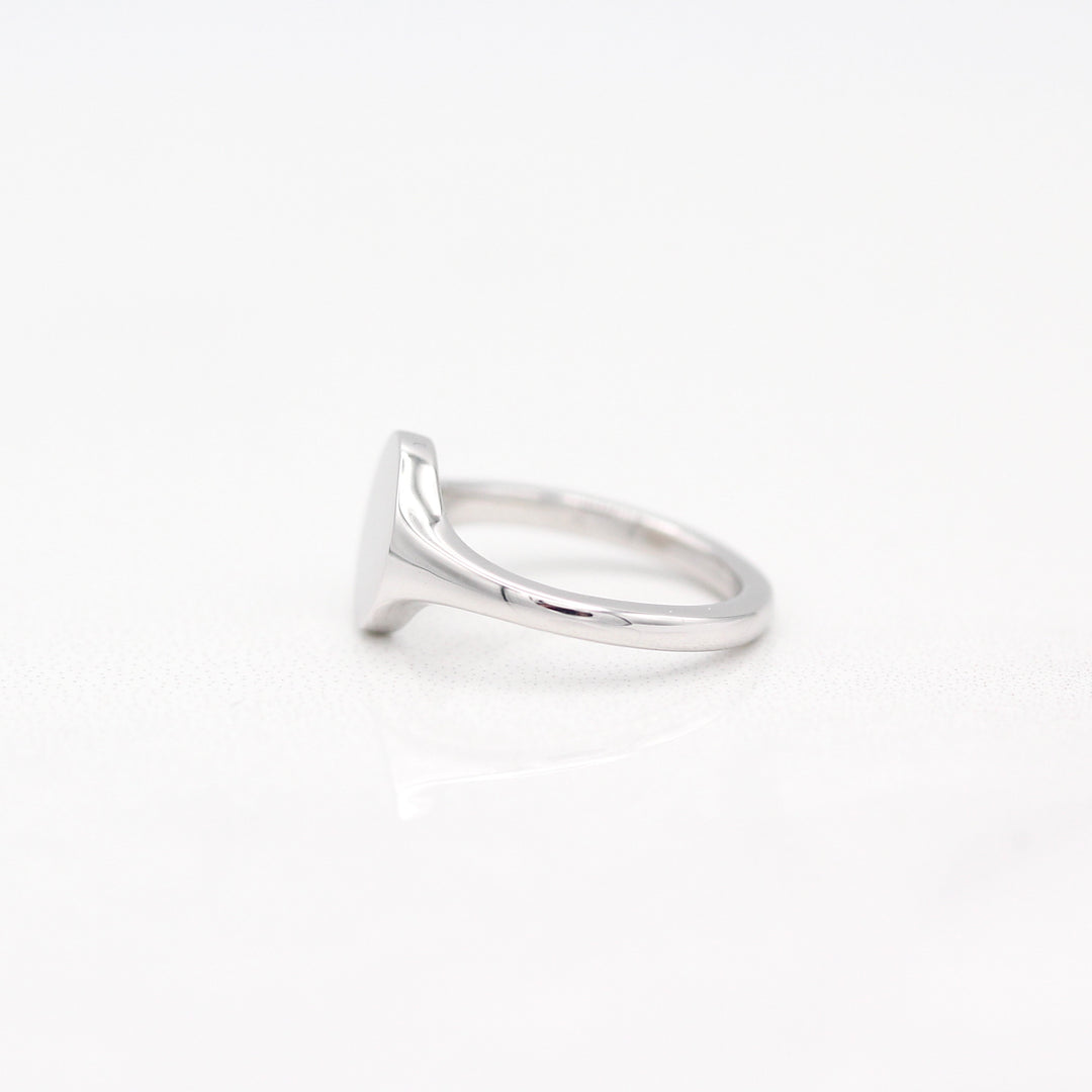 Sterling Silver Oval Signet Pinky Ring with Tapered Band on a White Background