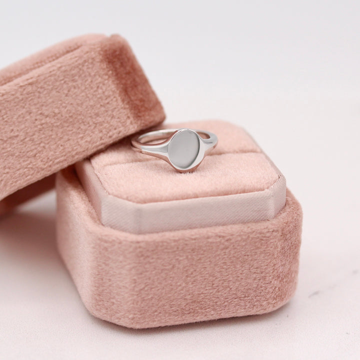 The Katherine Oval Signet Pinky Ring on a Pink Ring Box in Sterling Silver