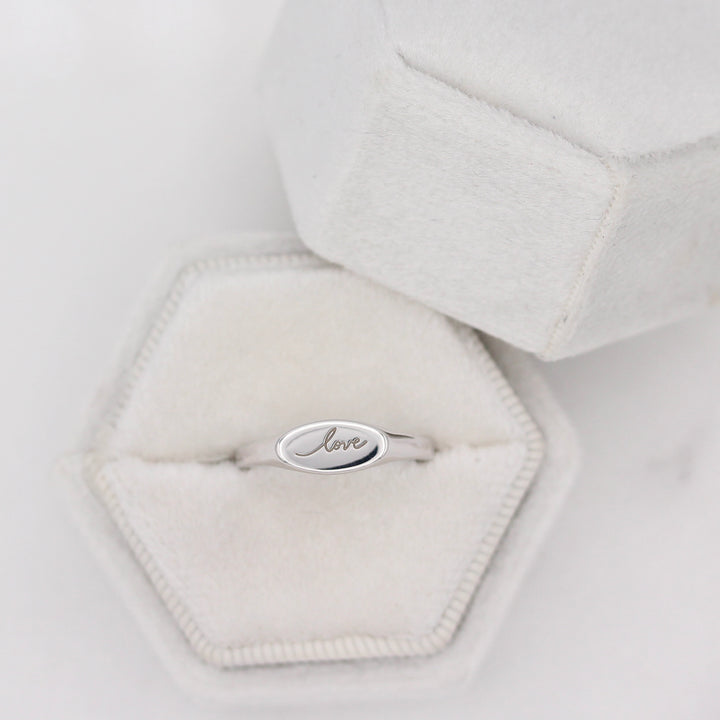 The Love Pinky Ring in a White Ring Box