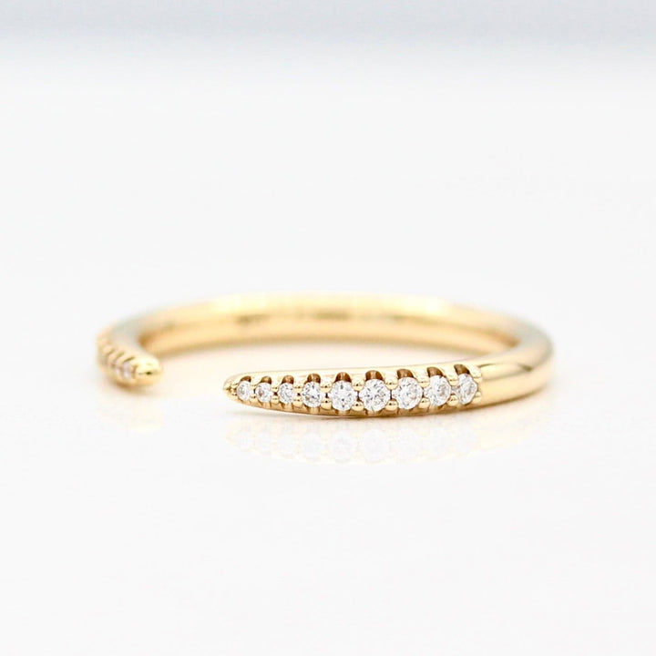 The Open Phoebe Wedding Band with a White Background
