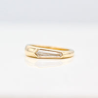 Bezel set Elongated Shield cut Diamond Pinky Ring in Yellow Gold on a White Background