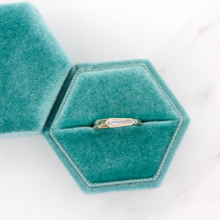 The Rowan Pinky Ring placed in a Dark Teal Velvet Ring Box