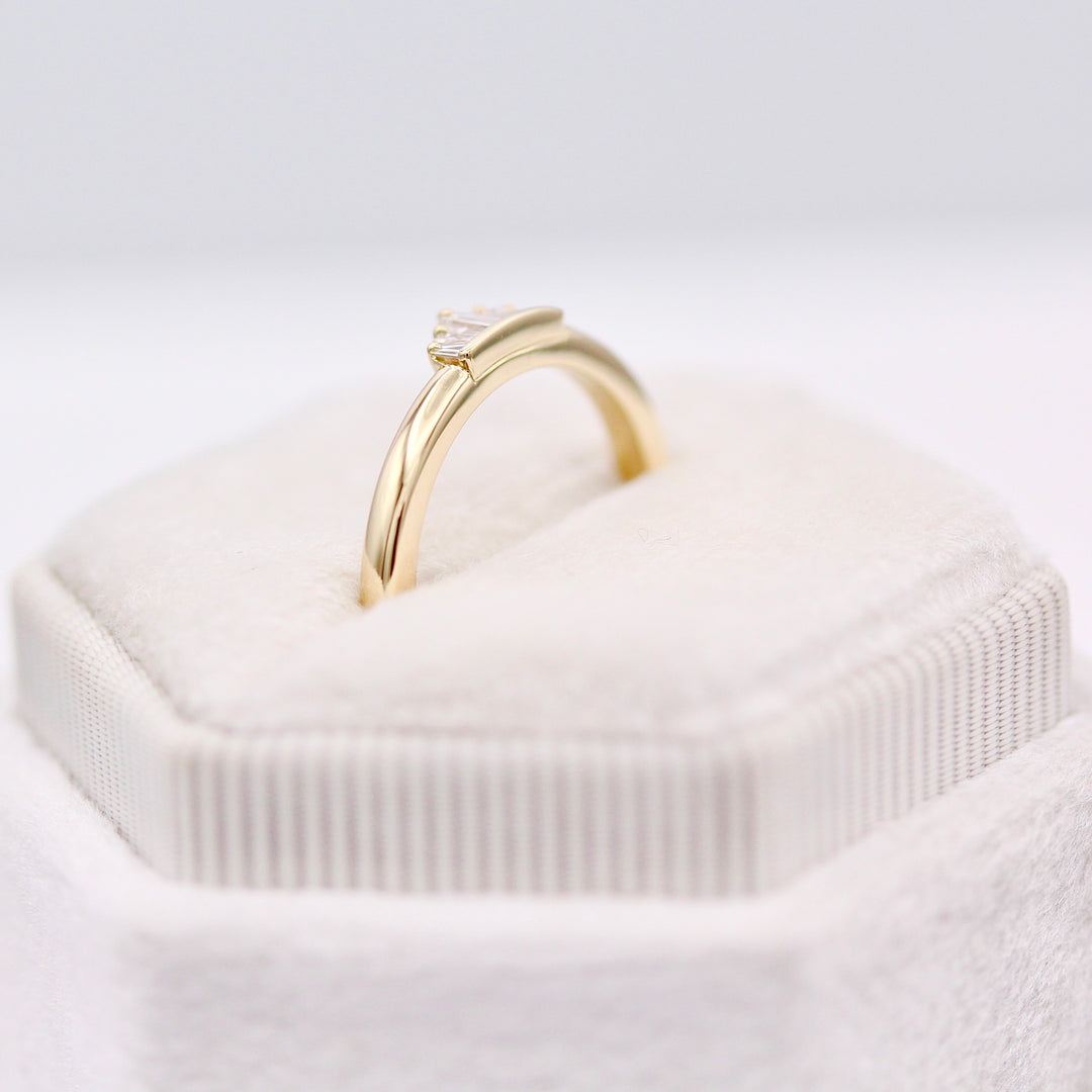 The True North Pinky Ring with yellow gold band in a white velvet ring box