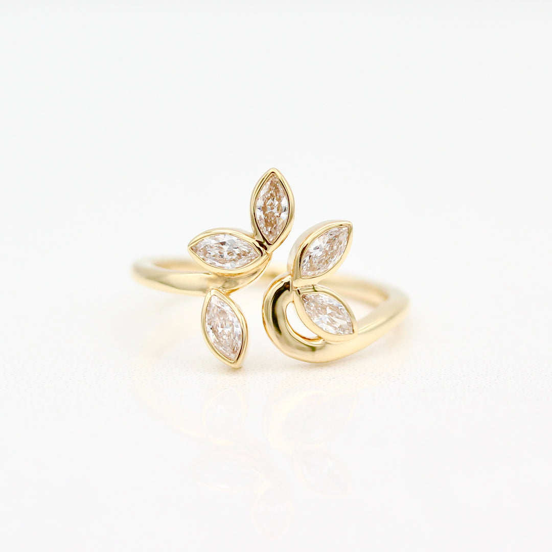 Yellow gold ring with five diamond marquise on a white background