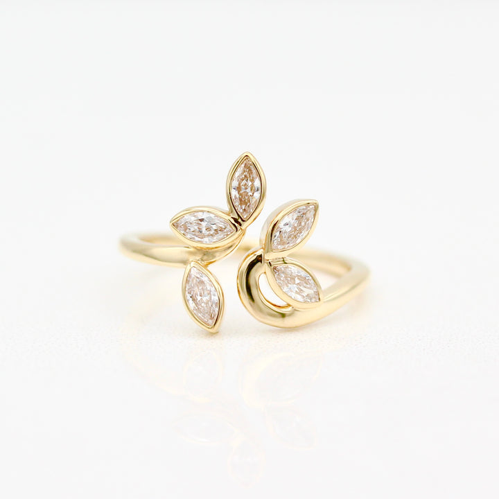 Yellow gold ring with five diamond marquise on a white background