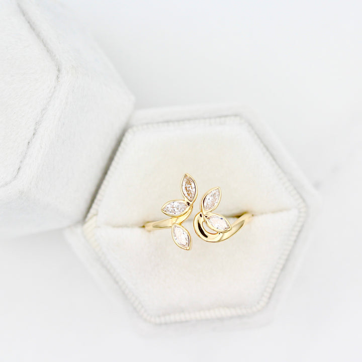The Violet, a floral inspired ring with five marquise diamonds in a white velvet ring box