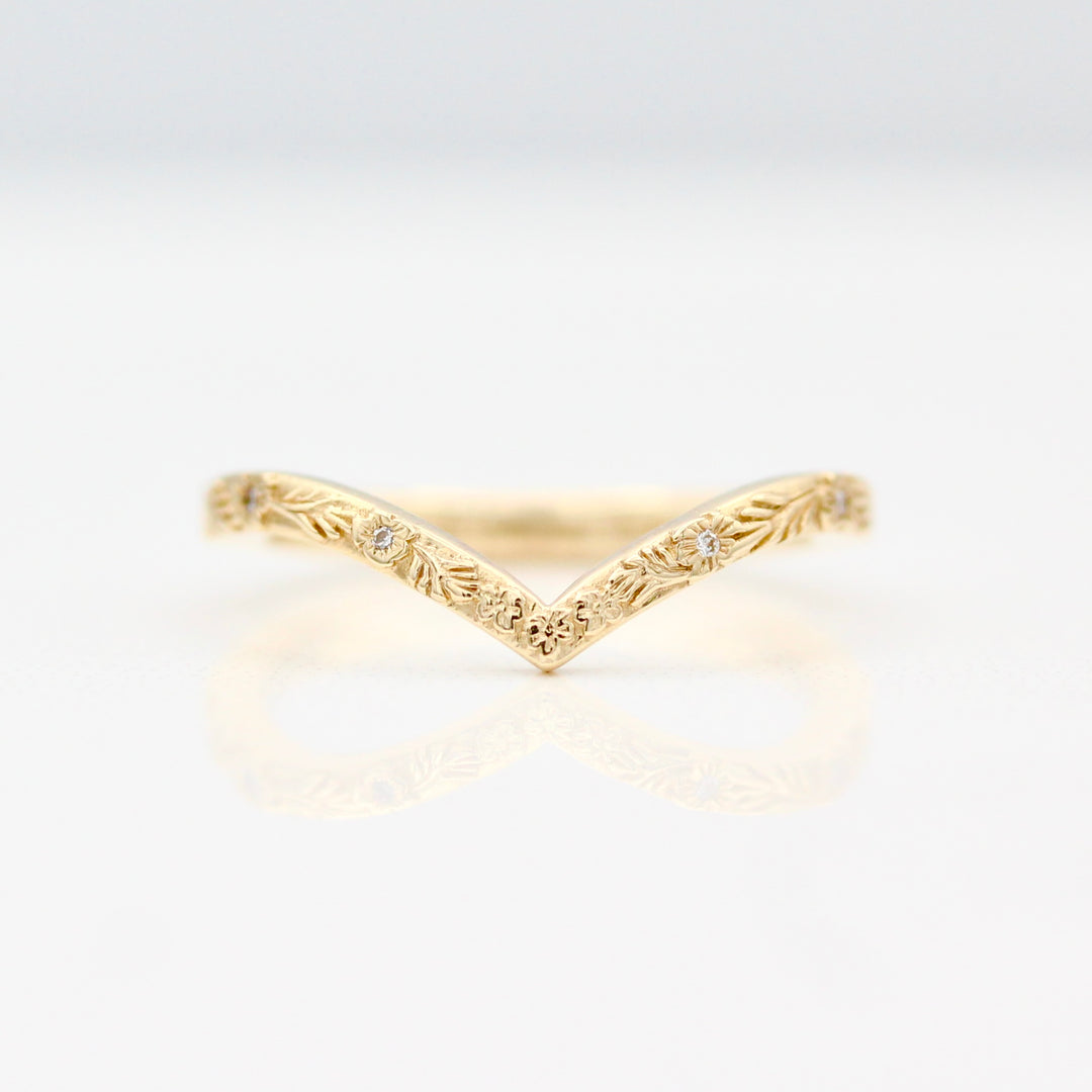 Engraved Floral V shaped Wedding Band with inset Round Lab-Grown Diamonds in Yellow gold.