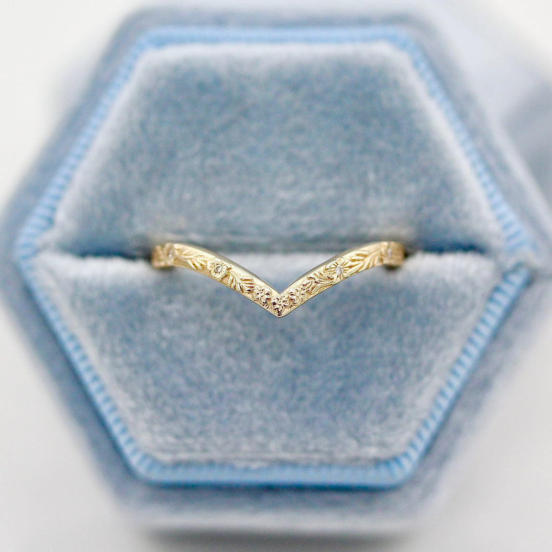 The Willow Wedding Band in Yellow Gold in a Blue Velvet Ring Box.