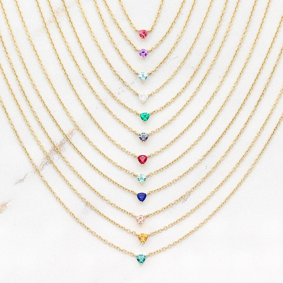 The Tiny Trillion Birthstone Necklaces in Yellow Gold against a white background