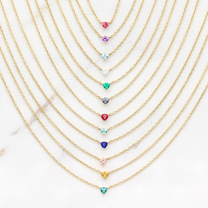The Tiny Trillion Birthstone Necklaces in Yellow Gold against a white background