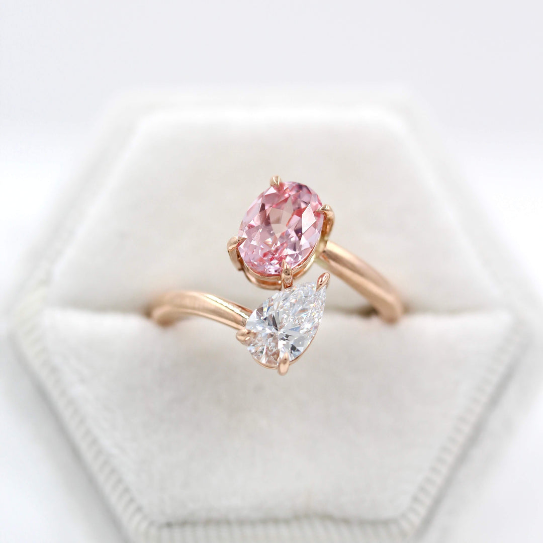 Toi et Moi Diamond and Peachy-Pink Sapphire Bypass Ring in Rose Gold in a white velvet ring box