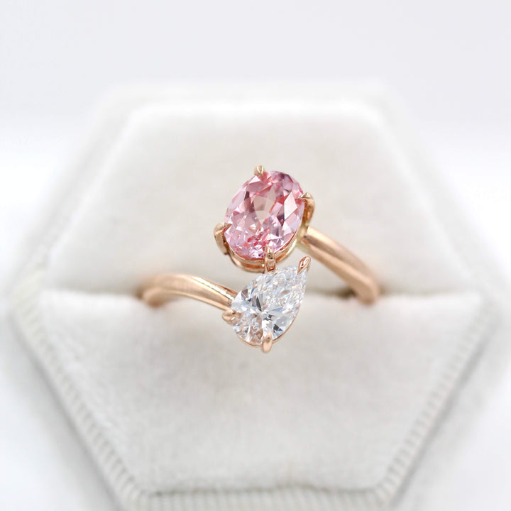 Toi et Moi Diamond and Peachy-Pink Sapphire Bypass Ring in Rose Gold in a white velvet ring box