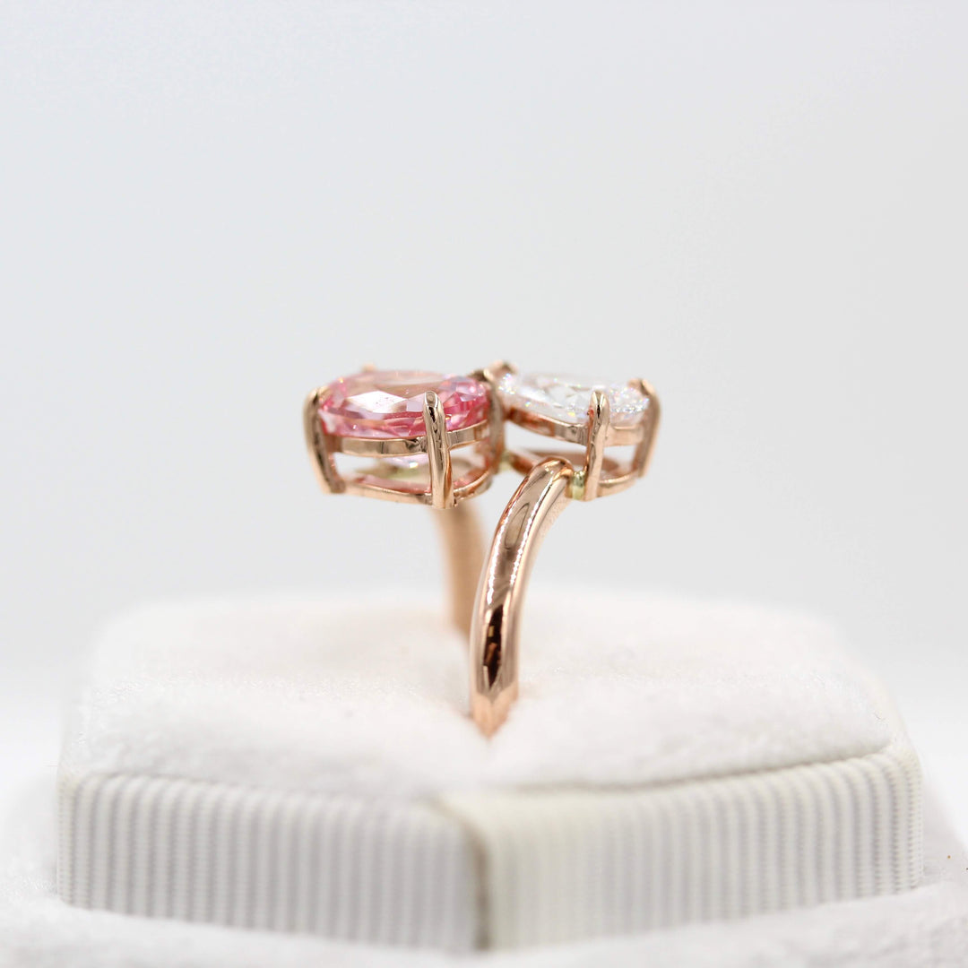 Toi et Moi Diamond and Peachy-Pink Sapphire Bypass Ring in Rose Gold in a white velvet ring box