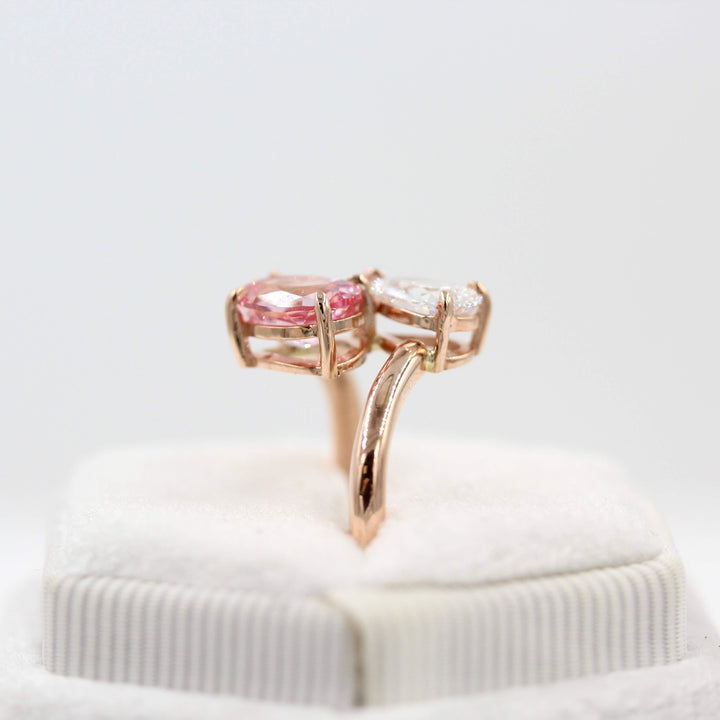 Toi et Moi Diamond and Peachy-Pink Sapphire Bypass Ring in Rose Gold in a white velvet ring box