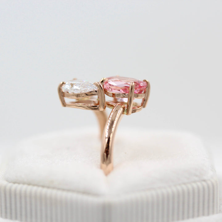 Toi et Moi Diamond and Peachy-Pink Sapphire Bypass Ring in Rose Gold in a white velvet ring box