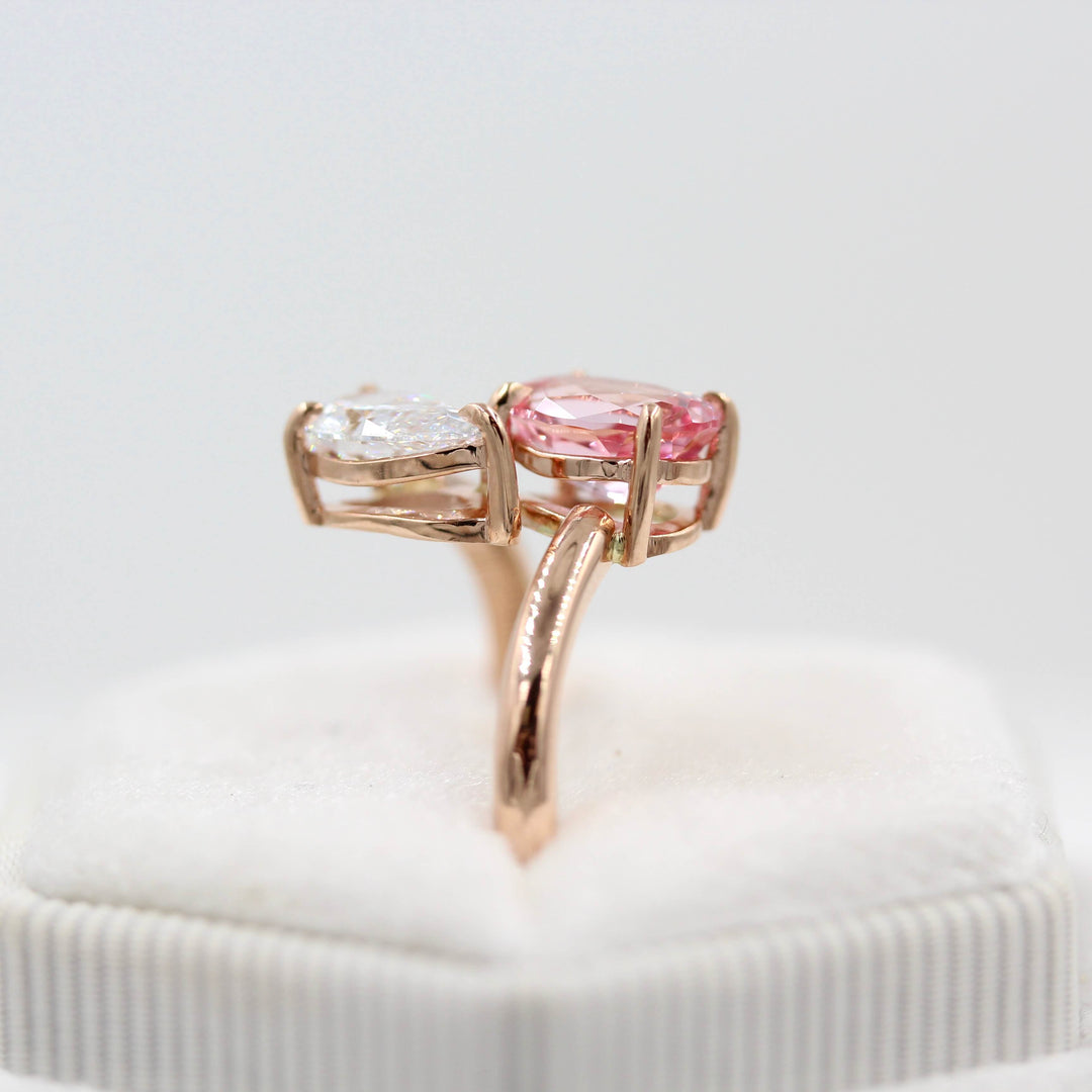 Toi et Moi Diamond and Peachy-Pink Sapphire Bypass Ring in Rose Gold in a white velvet ring box