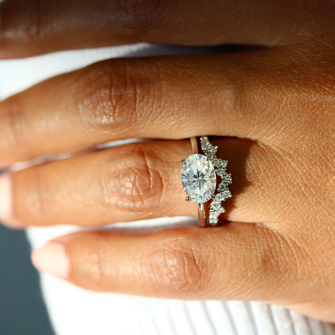 The Twyla Ring (Oval) in White Gold stacked with the Nova wedding band in white gold modeled on a hand