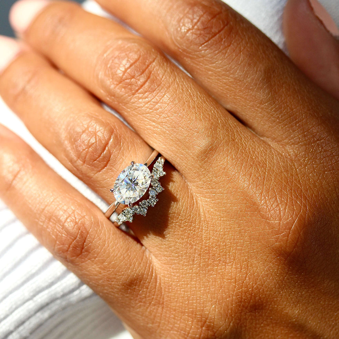 The Twyla Ring (Oval) in White Gold stacked with the Nova wedding band in white gold modeled on a hand