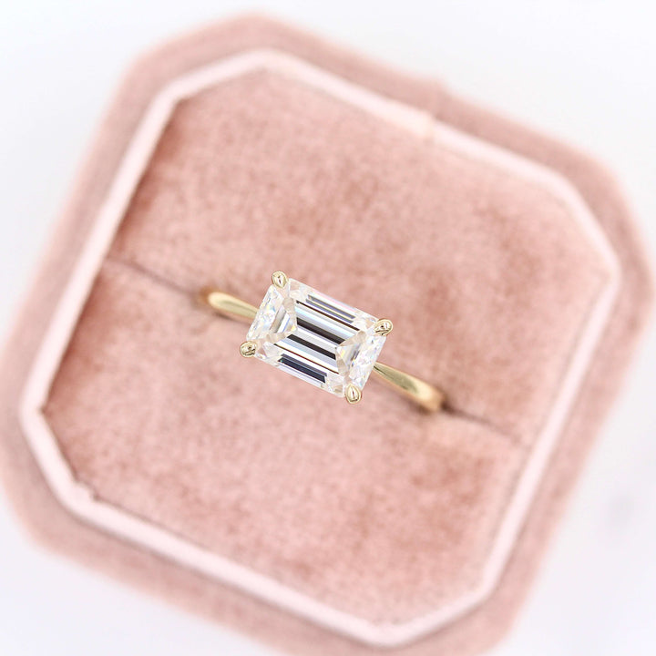 The Twyla ring emerald in yellow gold in a pink velvet ring box