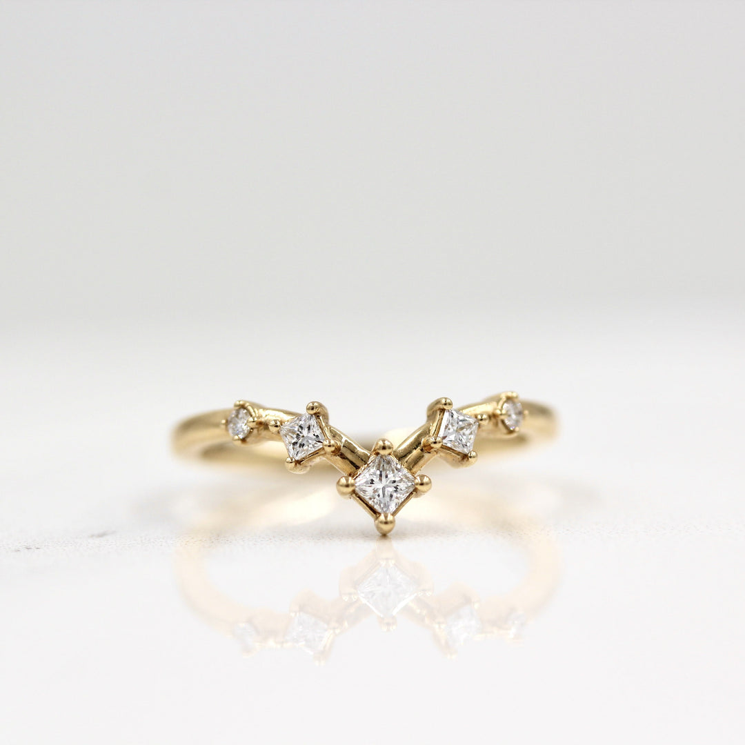 The Astra Wedding Band in Yellow Gold against a white background